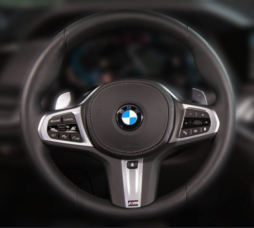 BMW stock vs sport steering wheel - OEM wheel